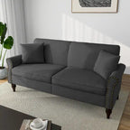 Canapé 73 avec accoudoirs roulés et finition à clous décoratifs