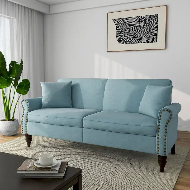 Canapé 73 avec accoudoirs roulés et finition à clous décoratifs